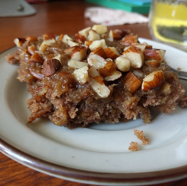a moist peace of oatmeal cake, with almond topping.